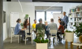 Happy casual business team in meeting {{brizy_dc_image_alt entityId=