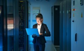 IT engineer specialist working in network server room {{brizy_dc_image_alt entityId=